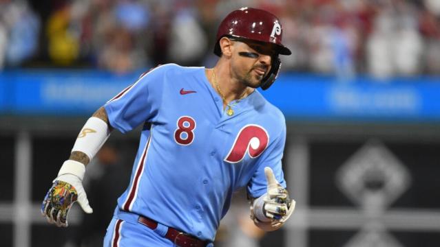 Philadelphia Phillies - Photo of Nick Castellanos wearing the powder blue  Phillies jersey in the dugout.