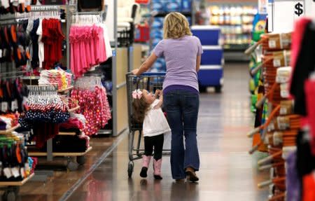 FILE PHOTO: A woman shops with her daughter at a Walmart Supercenter in Rogers, Arkansas, U.S., June 6, 2013.    REUTERS/Rick Wilking/File Photo