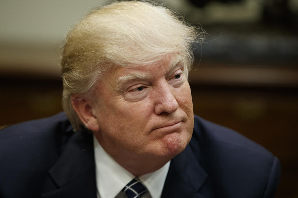 President Donald Trump listens during a meeting with the Fraternal Order of Police, Tuesday, March 28, 2017, in the Roosevelt Room of the White House in Washington. (AP Photo/Evan Vucci)