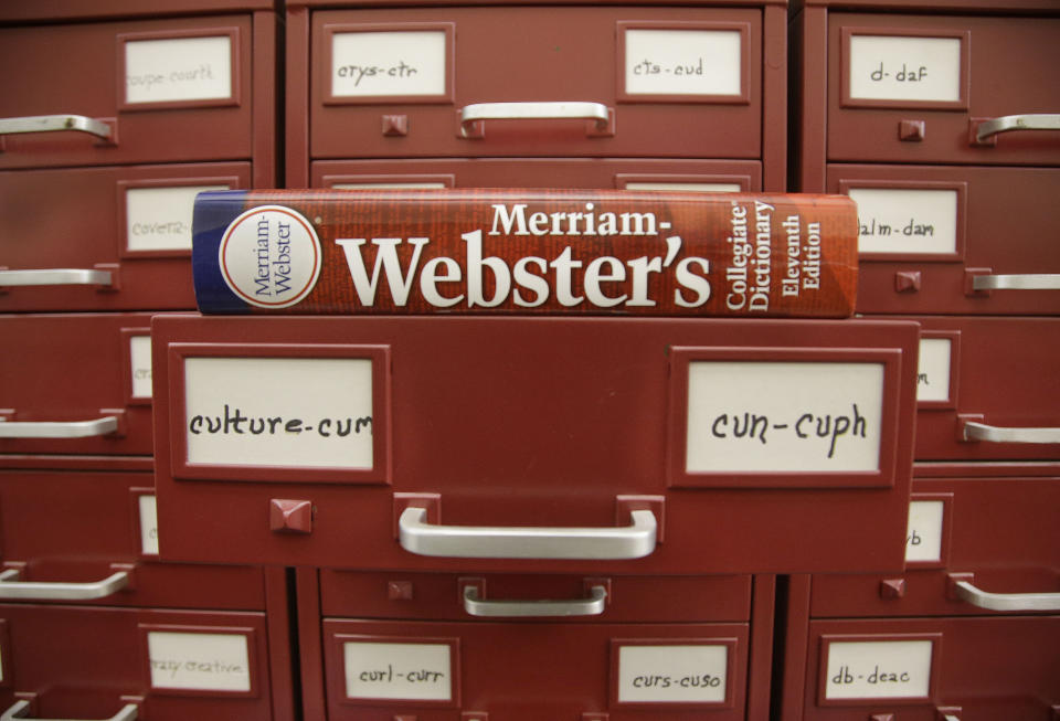 FILE - A Merriam-Webster dictionary sits atop their citation files at the dictionary publisher's offices on Dec. 9, 2014, in Springfield, Mass. Merriam-Webster's word of the year for 2023 is “authentic.” (AP Photo/Stephan Savoia, File)