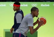 Kevin Durant (USA) of USA and Kyle Lowry (USA) of USA train. REUTERS/Jim Young