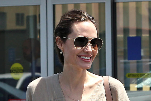 Angelina Jolie Takes On the Head-to-Toe Beige Trend in a Sweater Dress &  Sandals