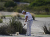 Bryson DeChambeau, of the United States, hits out of a bunker on the 8th hole during the first round of the Hero World Challenge PGA Tour at the Albany Golf Club, in New Providence, Bahamas, Thursday, Dec. 2, 2021.(AP Photo/Fernando Llano)