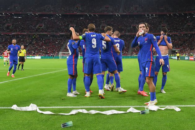 <strong>Jack Grealish drinks from a cup thrown from the crowd after Harry Maguire scores the third goal during the 2022 FIFA World Cup qualifier in Budapest.</strong> (Photo: Michael Regan via Getty Images)