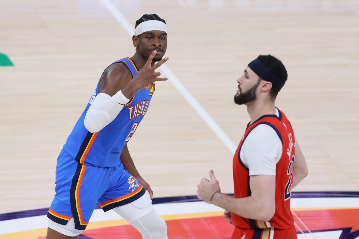 Oklahoma City Thunder guard Shai Gilgeous-Alexander (2) celebrates beside New Orleans Pelicans forward Larry Nance Jr. (22) after making a 3-pointer during Game 2 of the NBA basketball playoff series between the Oklahoma City Thunder and the New Orleans Pelicans at Paycom Center in Oklahoma City, Wednesday, April 24, 2024.