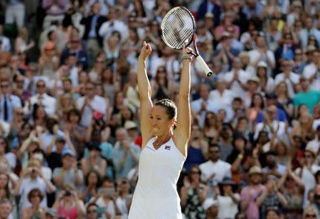 Jelena Jankovic of Serbia celebrates after winning her match against Petra Kvitova of the Czech Republic at the Wimbledon Tennis Championships in London, July 4, 2015. REUTERS/Henry Browne