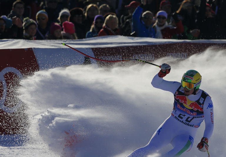 Italy's Dominik Paris reacts after competing in the FIS World Cup men's downhill race on January 26, 2013 in Kitzbuehel, Austria. Five-star Austrian glamour and glitz combine every year with raucous, drunken horn-blowing revellery in homage to the "Super Bowl" of alpine skiing, the Hahnenkamm races