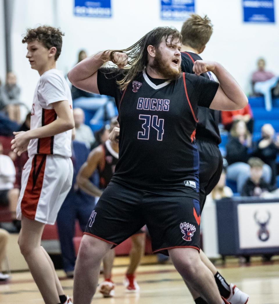 Bozeman senior Blake Fountain flexes after muscling up two points. Bozeman hosted Ponce De Leon High School in boys basketball Thursday, January 20, 2022.