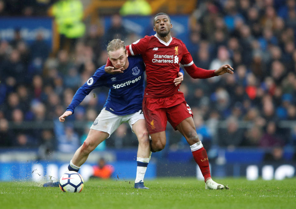 <p>Liverpool’s Georginio Wijnaldum iwraps himself around Everton’s Tom Davies </p>
