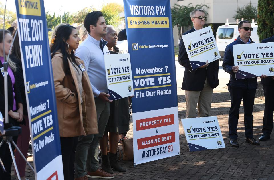 OneSpartanburg, Inc. Executive Board held a press conference in downtown Spartanburg on Oct. 18, 2023. OneSpartanburg approved a resolution to support the continuation of the penny sales tax that will be on the voters' ballots on Nov. 7, 2023. If the referendum passes, funds may be used to address some of the road conditions and deadliest intersections in the county. Here, supporters of the penny tax show support for the passage of the tax to help fix the roads in the county.