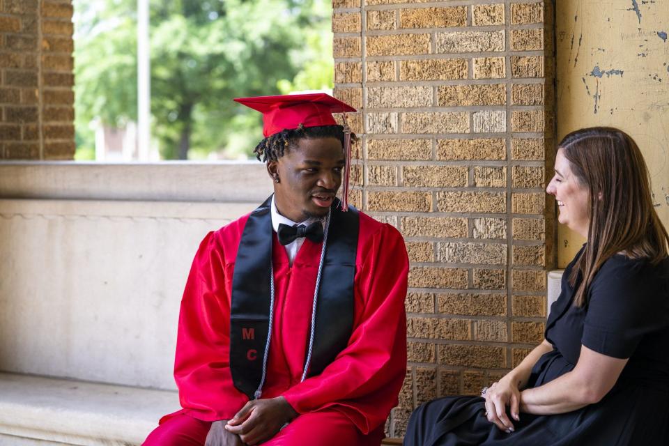 Brandon Washington speaking with his LifeSet specialist, Claudia Wilder, on the day of his high school graduation.