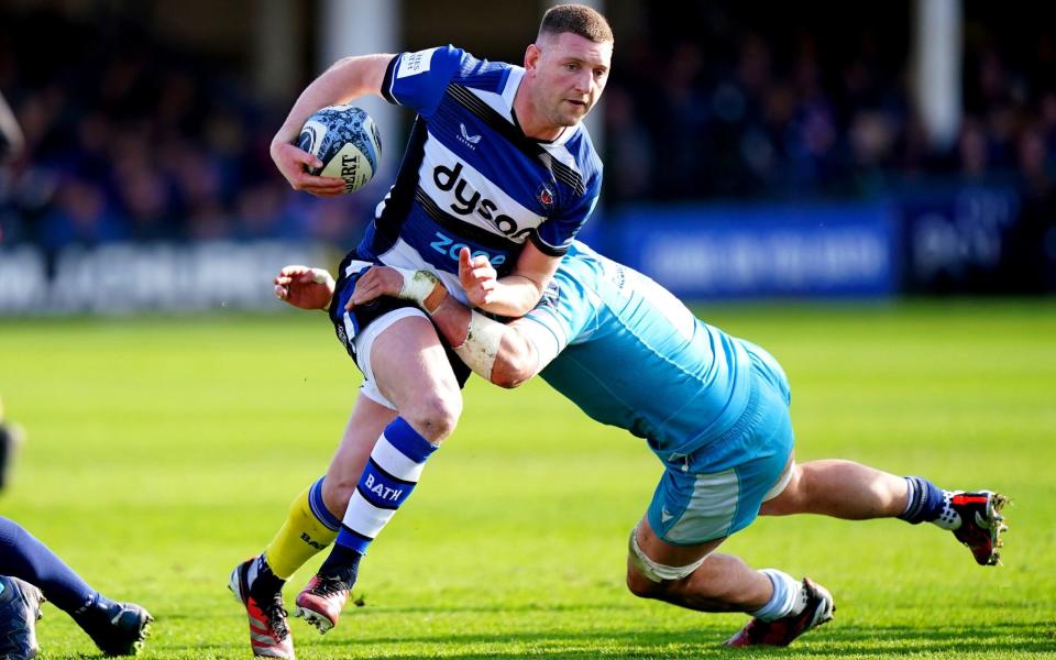 Finn Russell is tackled by Sam Dugdale