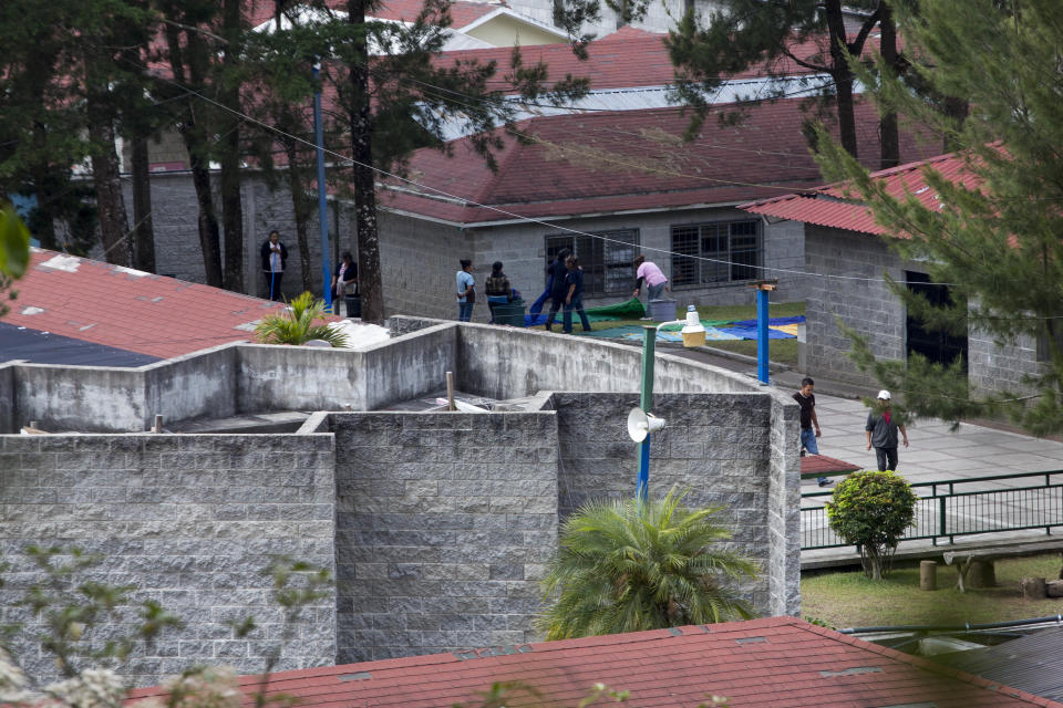 In this March 15, 2017 photo, workers clean blankets at the Virgen de la Asuncion Safe Home in San Jose Pinula, Guatemala. Abuse at Virgen de la Asunción was no secret, and the courts have intervened before. Teacher Edgar Rolando Diéguez Ispache has been in prison since 2013 and is on trial for alleged rape. Another employee, mason José Roberto Arias Pérez, has been in prison since 2014 for raping a mentally disabled girl. He was sentenced to eight years. (AP Photo/Moises Castillo)