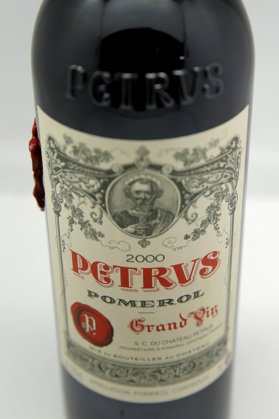 A bottle of Petrus red wine that spent a year orbiting the world in the International Space Station is pictured in Paris Monday, May 3, 2021. Christie’s said Tuesday May 4, 2021, they are offering the bottle of French wine for a private sale, with a stratospheric price tag in the region of euro 1 million. (AP Photo/Christophe Ena)