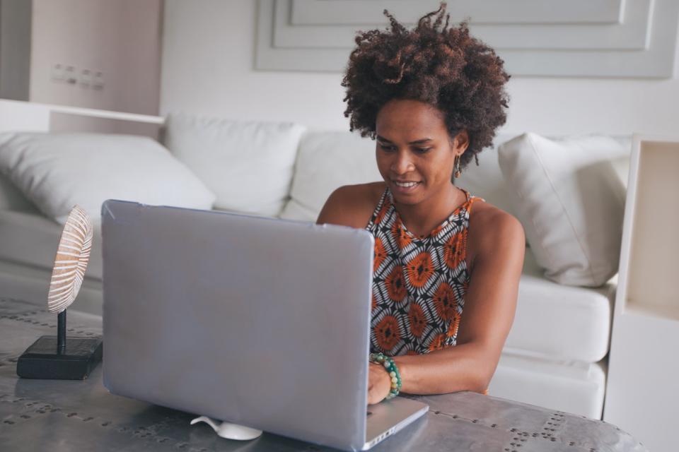 Investor with laptop working from home.