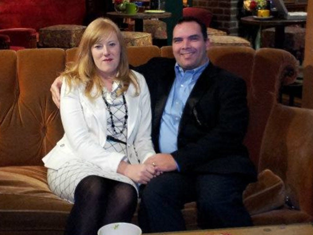 Kristine and Michael Barnett on a couch