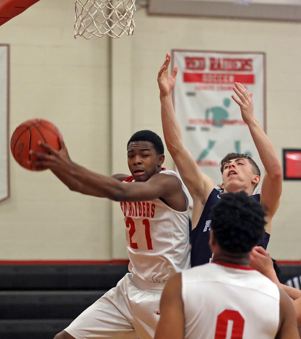 Alexander Hamilton's Jaylen Savage (21) and Pine Plains' Calab McCaul (10) battle for a rebound during the boys basketball Class C semifinals in Elmsford on March 11, 2020.