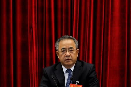FILE PHOTO - Guangdong provincial party boss Hu Chunhua attends the Guangdong delegation's group discussion during the National People's Congress (NPC), at Capital Hotel in Beijing, China March 6, 2017. REUTERS/Tyrone Siu/File Photo