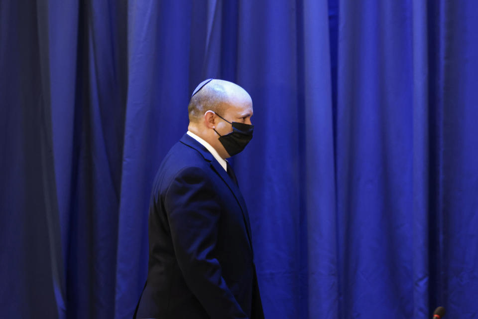 Israeli Prime Minister Naftali Bennett arrives for the weekly cabinet meeting at the Foreign Ministry in Jerusalem, Sunday, Aug. 8, 2021. (Ronen Zvulun/Pool via AP)