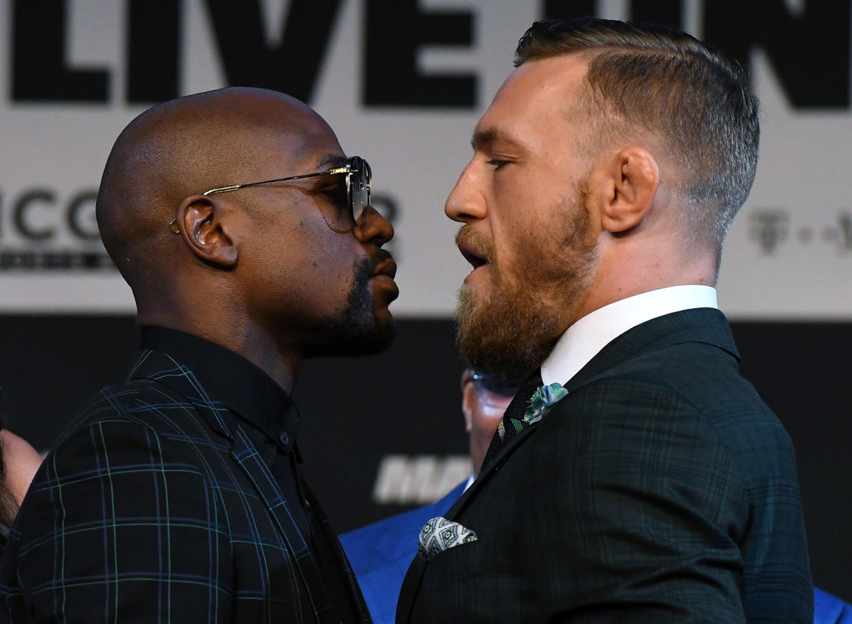 Floyd Mayweather Jr. and Conor McGregor prepare for their flashy fight. (Photo: Getty Images)