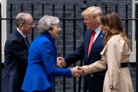 Britain's Prime Minister Theresa May and her husband Philip May greet US President Donald Trump and US First Lady Melania Trump outside 10 Downing Street. (Getty Images)