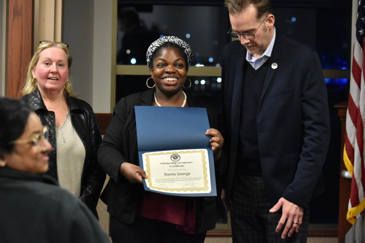 Ramie George, a South Bend School Corp. employee, holds the scholarship announced Wednesday for a program that will allow her to earn a bachelor's degree and her teaching license while retaining her current job.