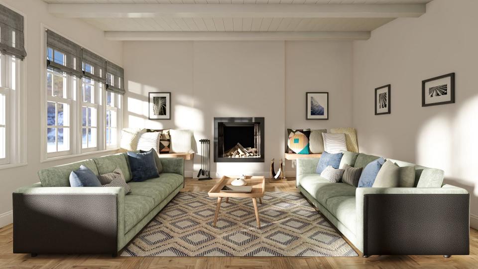 A large modern living room with walls painted in Sherwin-Williams Downy white and two long light-green sofas. 