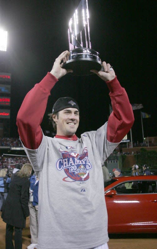 Phillies pitcher Cole Hamels holds his MVP trophy after Game 5 of the World Series in Philadelphia on Wednesday, Oct. 29, 2008.