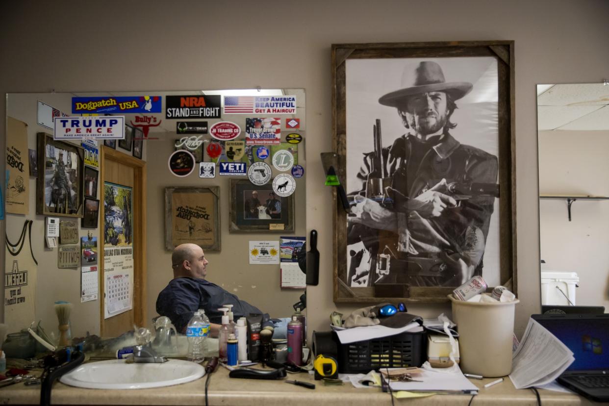 Shane Jones, owner of a gun and barber shop in Harrison, AR. (Photo: Eric Thayer for Yahoo News)