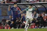 Austin FC defender Julio Cascante, right, and FC Dallas forward Petar Musa, left, try to control the ball during the first half of an MLS soccer match Saturday, May 11, 2024, in Frisco, Texas. (AP Photo/LM Otero)