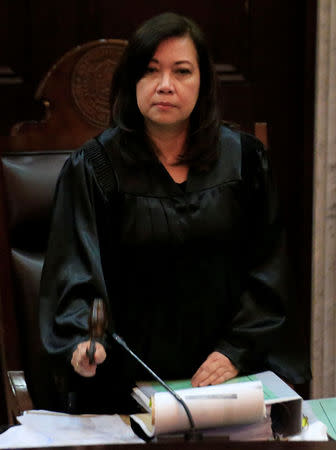 Supreme Court Chief Justice Maria Lourdes Sereno hits a gavel signifying the start of the oral arguments on the consolidated petitions to declare Philippine President Rodrigo Duterte's drug war unconstitutional at the Supreme Court in Manila, Philippines November 21, 2017. REUTERS/Romeo Ranoco