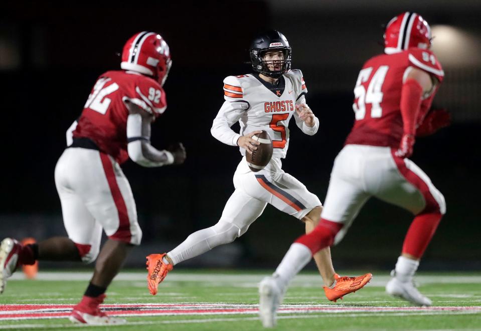 Kaukauna's Finnley Doriot (5) looks to pass against Neenah during their football game Sept. 8 in Fox Crossing.