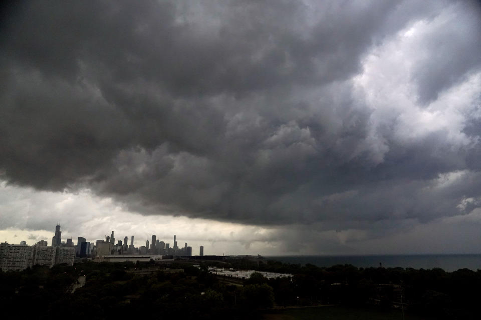 Storm clouds pass over downtown Chicago and the Bronzeville neighborhood of the city heading East out over Lake Michigan as the National Weather Service continued to issue multiple tornado warnings in the greater metropolitan area Wednesday, July 12, 2023. (AP Photo/Charles Rex Arbogast)