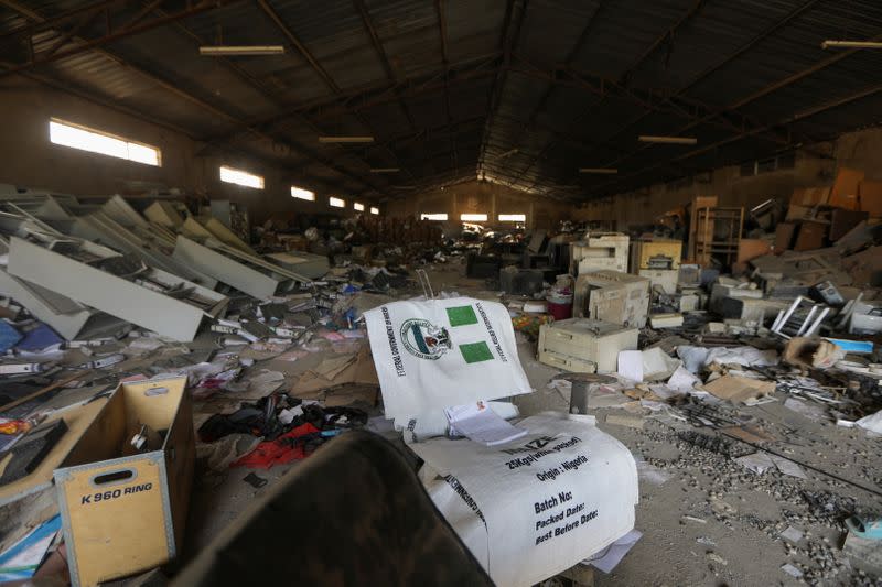 Damage goods are pictured after the looting of NEMA warehouse in Abuja