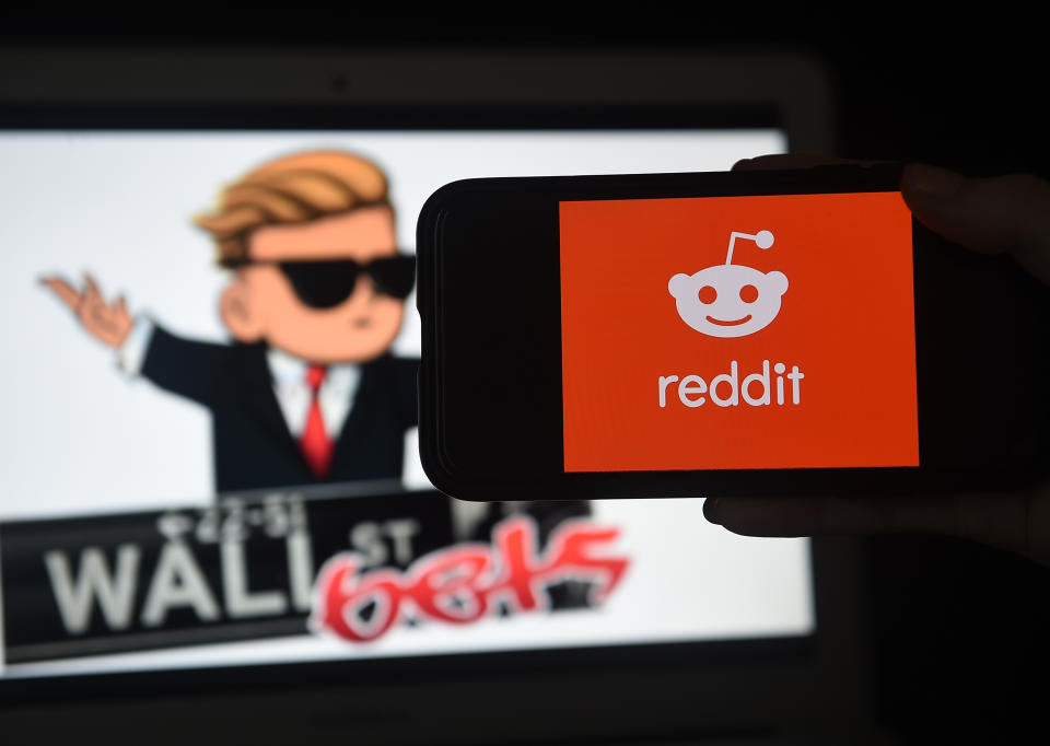 This photo illustration shows the logo of WallStreetBet on a computer and the Reddit logo on a mobile phone in Arlington, Virginia on January 29, 2021. - The US Securities and Exchange Commission (SEC) on Friday said its regulators were keeping an eye on the whipsawing share prices of some Wall Street stocks that had been targeted by a social media-driven campaign intended to make wealthy hedge funds suffer. (Photo by Olivier DOULIERY / AFP) (Photo by OLIVIER DOULIERY/AFP via Getty Images)