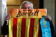 A protestor holds the Catalan flag as he awaits the arrival of sacked Catalan President Carles Puigdemont at a Belgian court to discuss the European arrest warrant Spain has issued against him, in Brussels, Belgium, November 17, 2017. REUTERS/Yves Herman