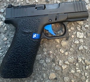 Firearm seized by police after searching two Toronto homes.