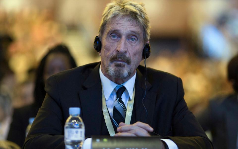 Founder of the first commercial anti-virus program that bore his name, John McAfee listens during the 4th China Internet Security Conference (ISC) in Beijing - AP