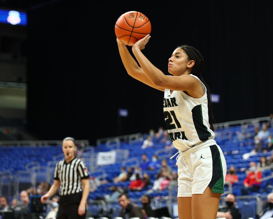 Gisella Maul shoots a 3-pointer for Cedar Park during the Class 5A state championship game against Frisco Liberty in March 2022 at the Alamodome. Cedar Park won its first state championship by a score of 46-39 that year.