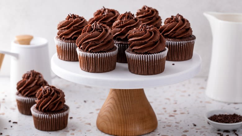 Chocolate buttercream cupcakes on stand