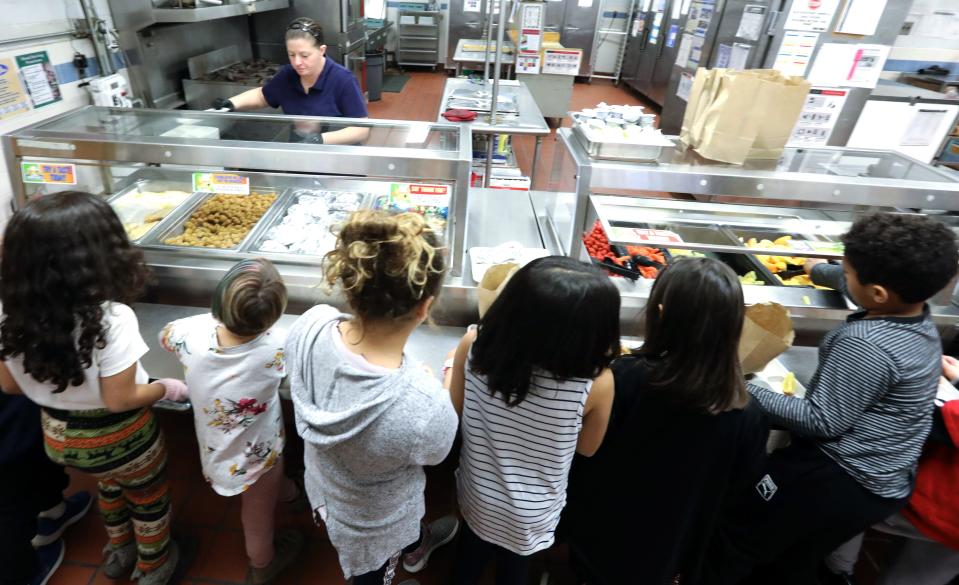 Students work their way down the lunch counter at R.P. Connor Elementary School in Suffern Dec. 9, 2019. 