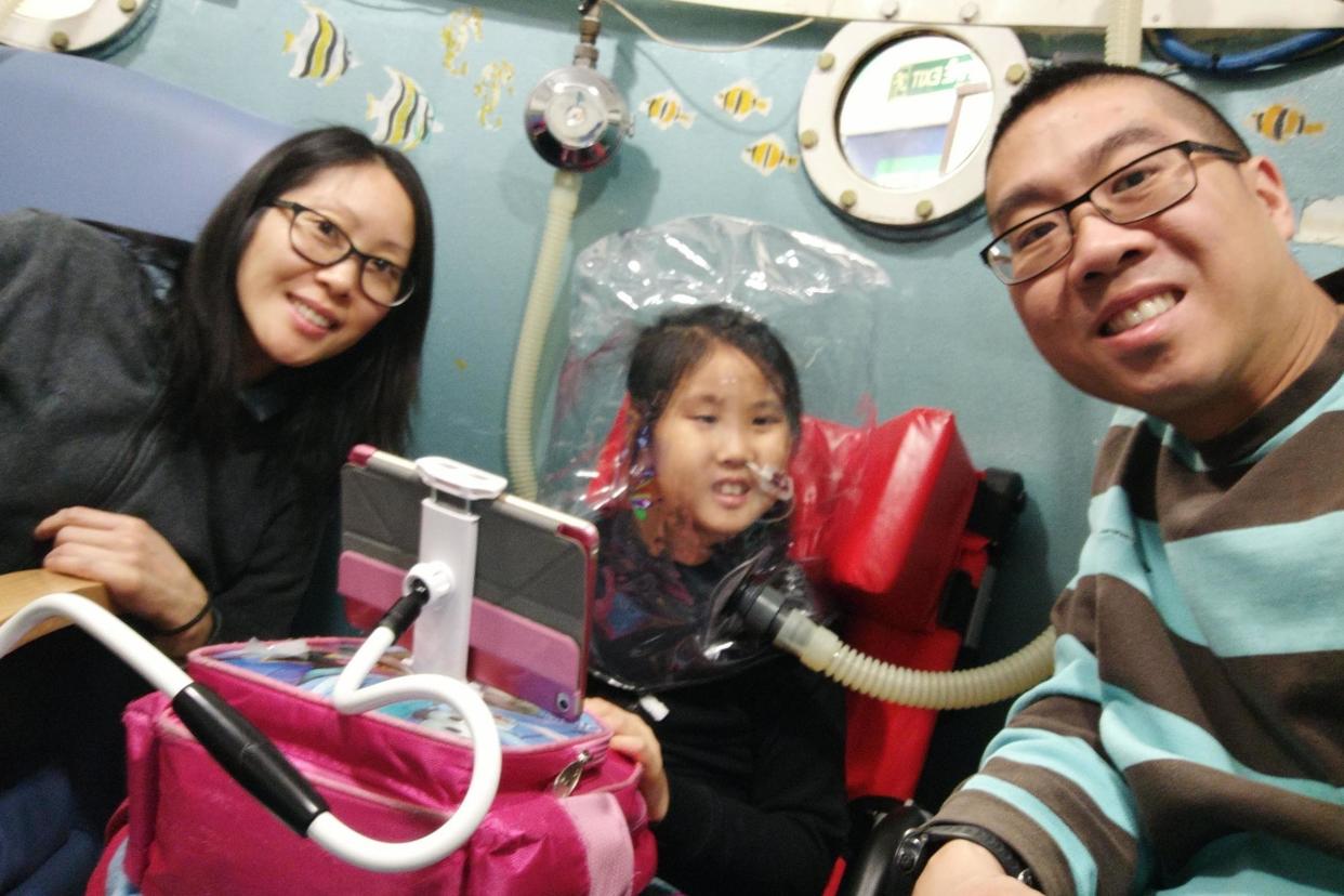 Appeal: Kaleigh with parents Scott and Yang: Family collect