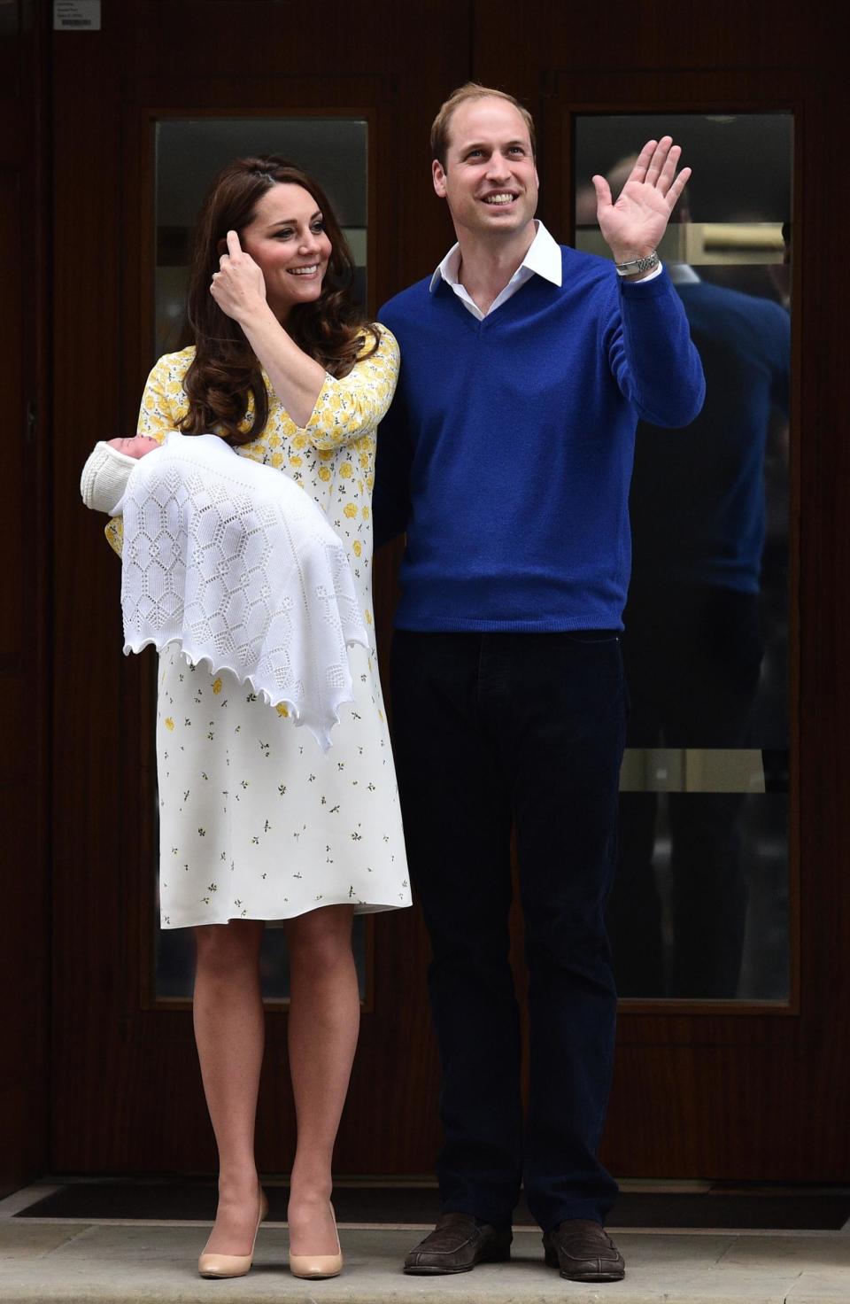 Kate and William pose with Princess Charlotte (AFP/Getty Images)