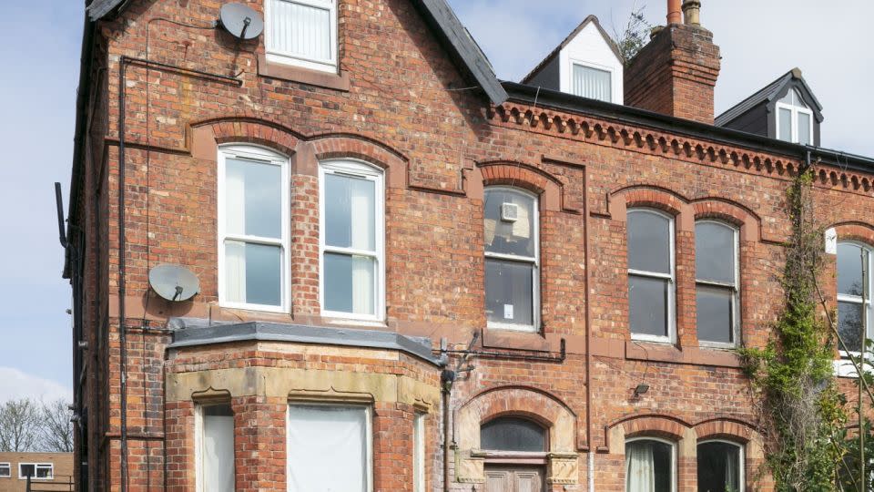 There is little to hint at what lies behind the front door of this red-brick house in Birkenhead, England. - Historic England