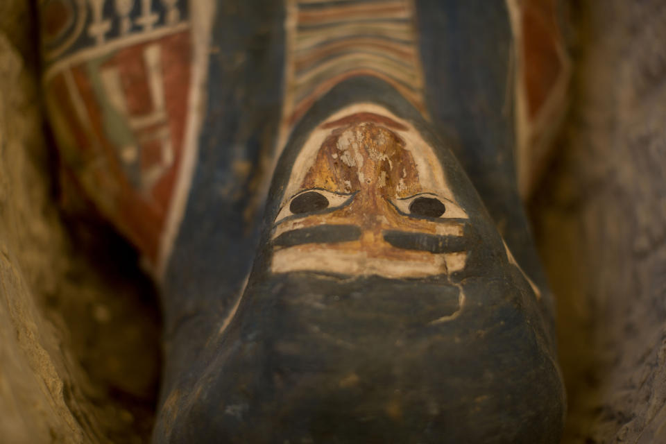 Detail of a recently discovered sarcophagus at the Memphis necropolis during an event opening the pyramid and its satellites for visitors in Dashur, Egypt, Saturday, July 13, 2019. An Egyptian mission led by Dr. Mostafa Waziri discovered a collection of stone, clay and wooden sarcophagi which some of it still houses its mummies in addition to wooden funerary masks and instruments used in cutting stones from the Late period. (AP Photo/Maya Alleruzzo)