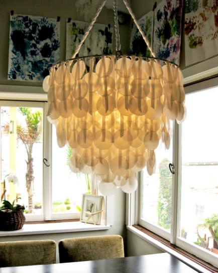<div class="caption-credit"> Photo by: Design Sponge</div><b>Paper capiz shell chandelier</b> <br> Breathtaking, right? Semi-transparent Capiz shells with their pearlescent finish are known for their lavish design features. Now you can get the expensive look of Capiz shell for a fraction of the cost with wax paper. Yes, wax paper! Create your very own faux Capiz chandelier to make a dramatic design statement that only looks like it cost a fortune! <br> <i>Get the full tutorial at <a rel="nofollow noopener" href="http://www.designsponge.com/2010/08/diy-project-brennas-paper-capiz-shell-chandelier.html" target="_blank" data-ylk="slk:Design Sponge" class="link ">Design Sponge</a></i>