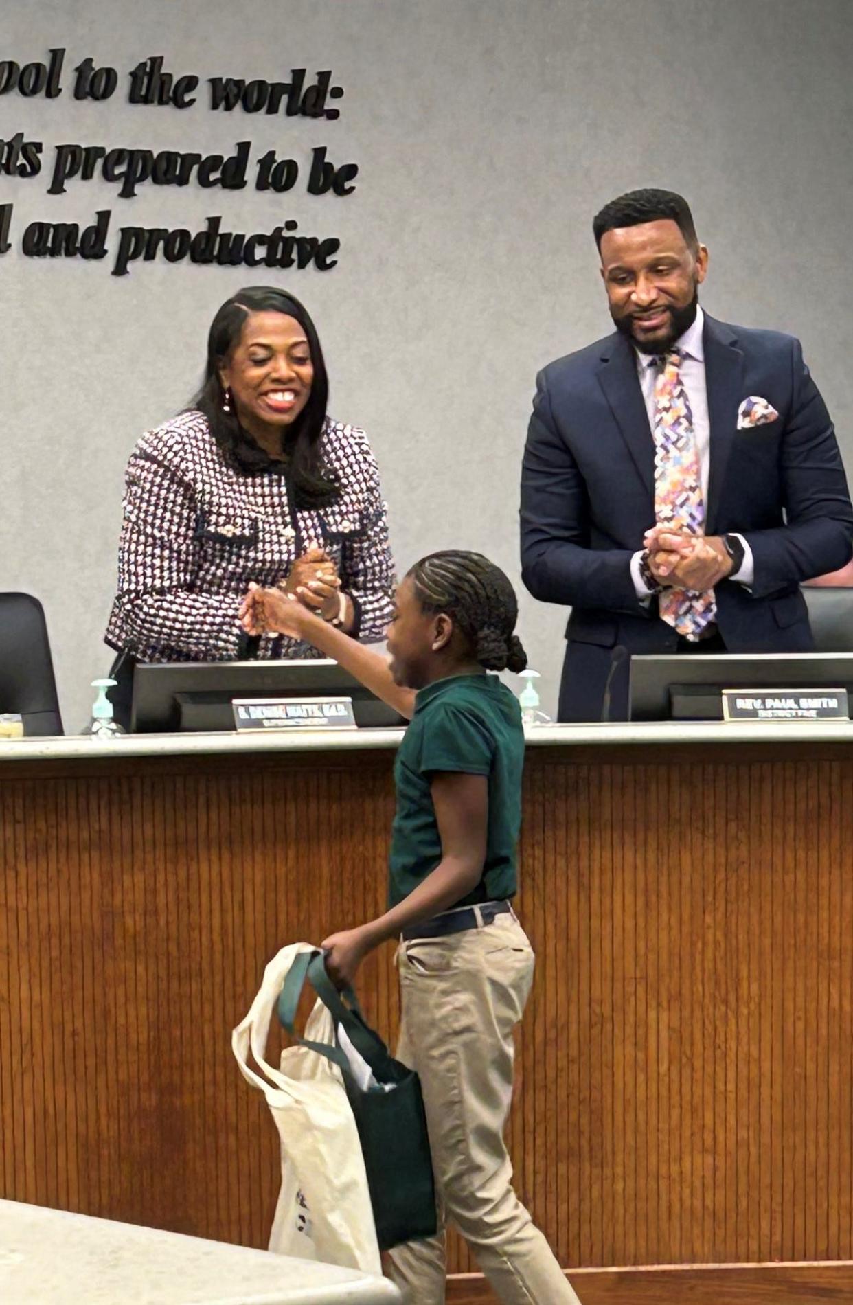 SCCPSS Superintendent Denise Watts, Ed.D., congratulates the district's January 2024 Student of the Month Nikori Morris (a fifth grader at Haven Elementary School), during the latest board meeting.