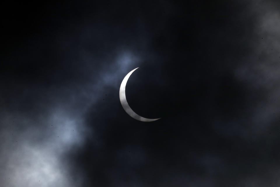 The sun forms crescent during solar eclipse in Kathmandu, Nepal, Sunday, June 21, 2020. (AP Photo/Niranjan Shrestha)