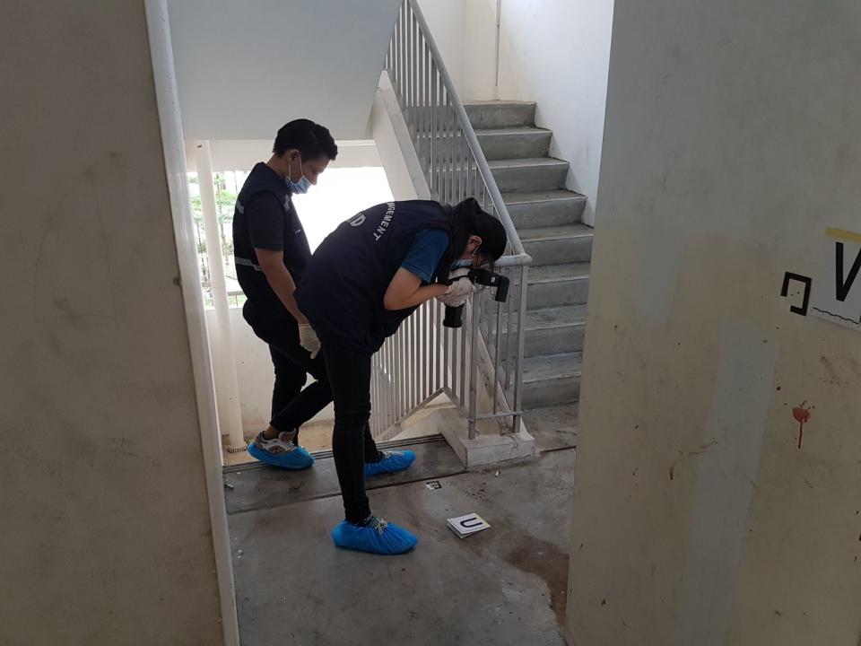 Investigators were seen at a crime scene at 165A Teck Whye Crescent. Photo: Safhras Khan/Yahoo News Singapore