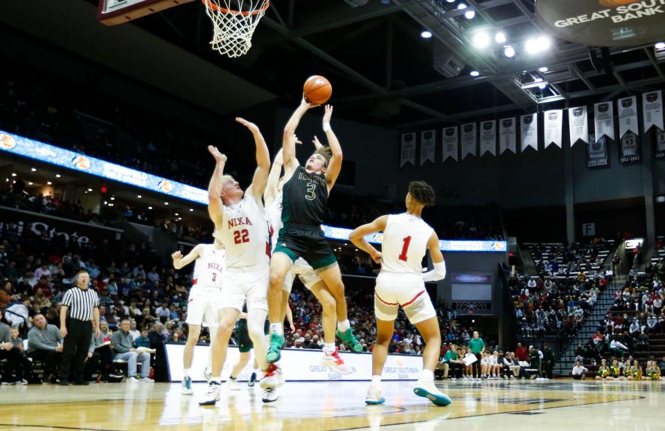 The Springfield Catholic Fightin' Irish took on the Nixa Eagles in the second round of the Bass Pro Shops Tournament of Champions at JQH Arena on Friday, Jan. 14, 2022, 